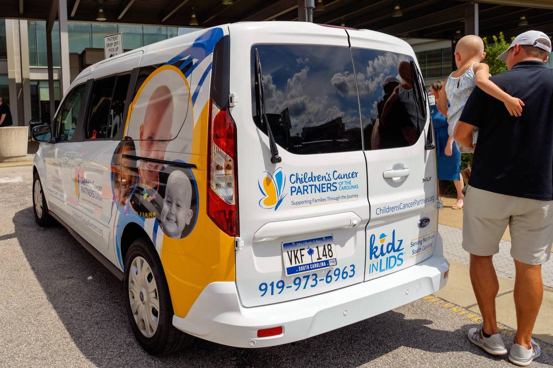 The new Family Assistance Van for Children’s Cancer Partners of the Carolinas was unveiled on Tuesday, July 12, in front of the North Carolina Cancer Hospital. The faces of three children who have received CCP support and funding were printed on both sides of the van.