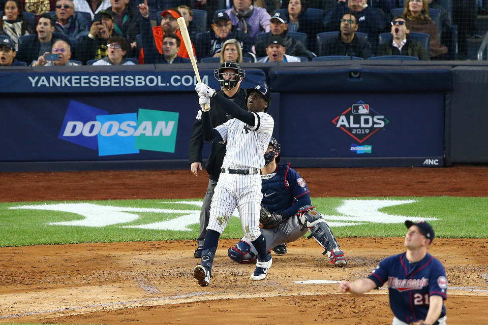 NEW YORK, NEW YORK - OCTOBER 05: Didi Gregorius #18 of the New York Yankees connects on a grand slam home run in the third inning against the Minnesota Twins during game two of the American League Division Series at Yankee Stadium on October 05, 2019 in New York City. (Photo by Mike Stobe/Getty Images)