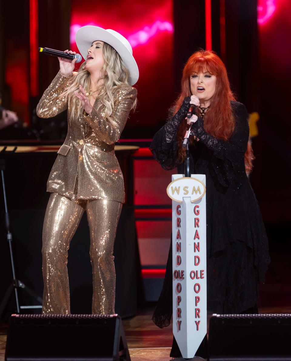 Lainey Wilson performs with Wynonna Judd at the Grand Ole Opry prior to being officially inducted as an Opry member on June 7, 2024.