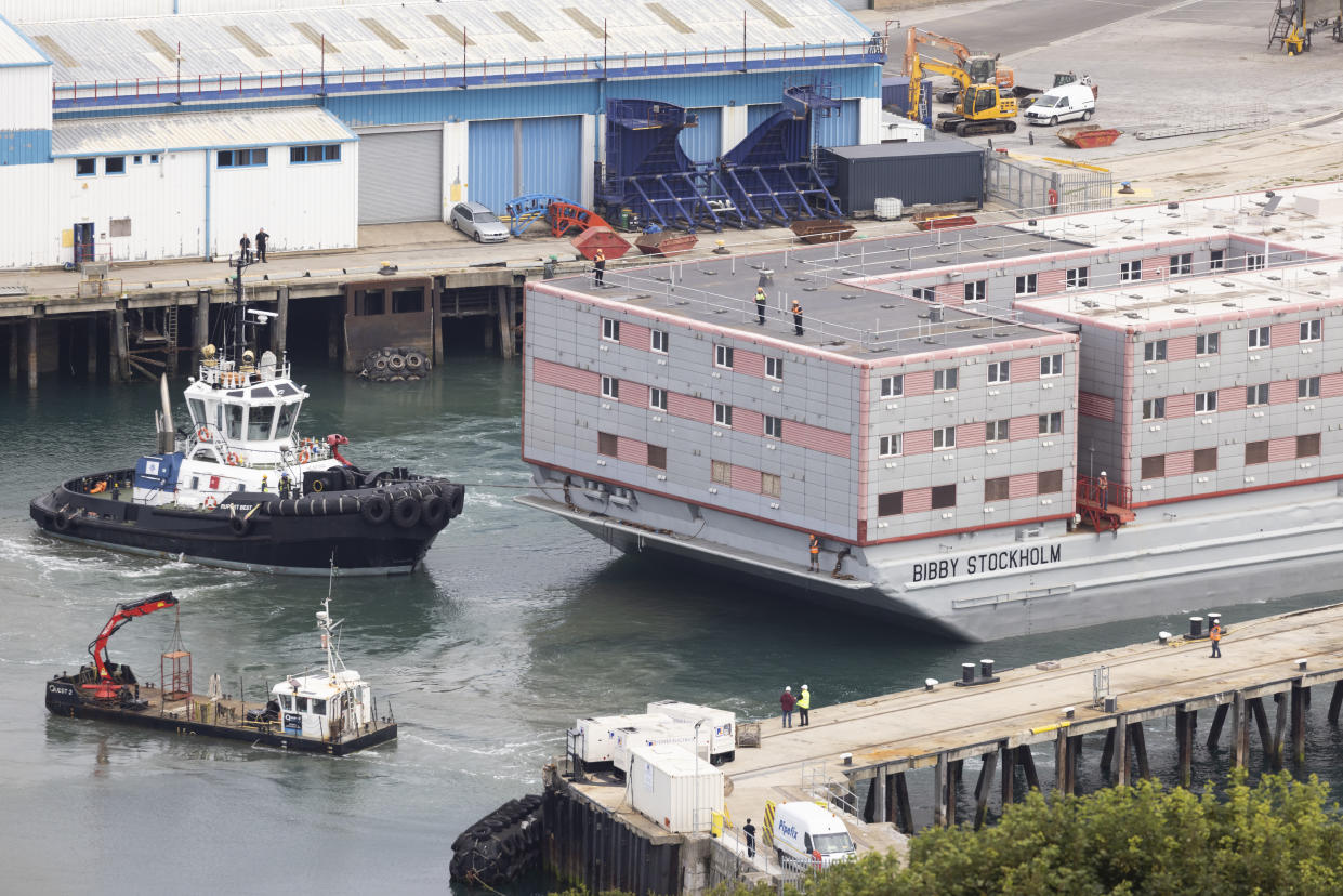 PORTLAND, ENGLAND - JULY 18: The Bibby Stockholm migrant barge is manoeuvred after arriving at Portland Harbour on July 18, 2023 in Portland, England. The Bibby Stockholm arrives in Portland, after a refit at Falmouth, to serve as living quarters for up to 500 asylum seekers to the UK. (Photo by Dan Kitwood/Getty Images)