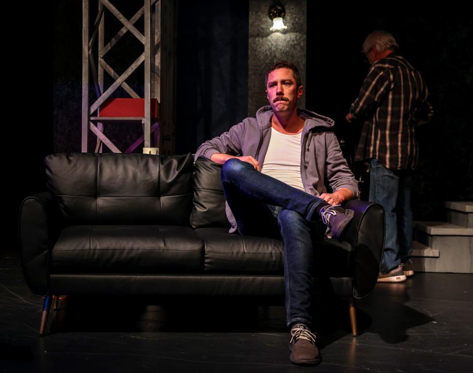 John Corr as fact checker Jim Fingal sits on the couch in deep thought during a scene in a dress rehearsal for Desert Ensemble Theatre's "The Lifespan of a Fact" at the Palm Springs Cultural Center in Palm Springs, Calif., Wednesday, Jan. 24, 2024.