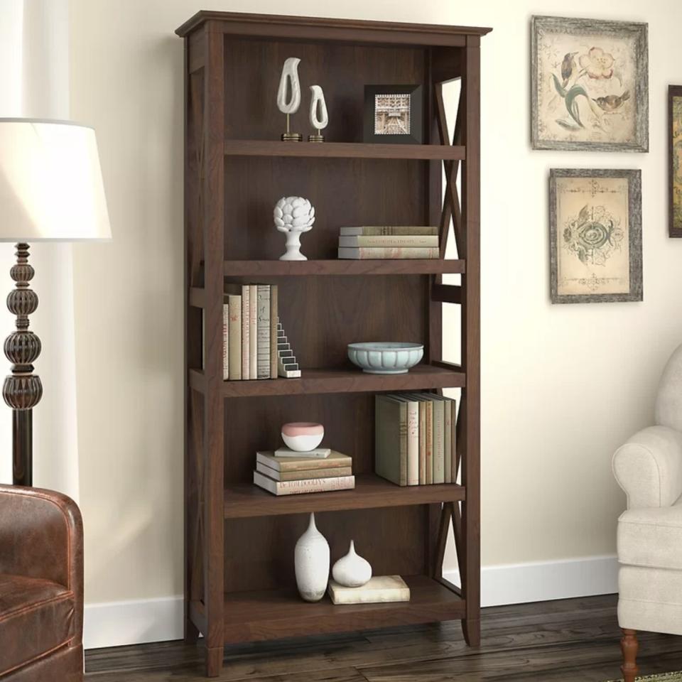 You'll love this bookcase that has plenty of shelving space and a vintage-esque aesthetic. <br /><br /><strong>Promising review:</strong> "Very nice bookshelf. I am surprised it holds the lot of books I had on my old bookshelf. Easy to put together." &mdash; <a href="https://go.skimresources.com?id=38395X987171&amp;xs=1&amp;xcust=-HPWayDaySale4-28-21-60896f93e4b09cce6c197126&amp;url=https%3A%2F%2Fwww.wayfair.com%2Ffurniture%2Fpdp%2Fbeachcrest-home-cyra-6598-h-x-3173-w-standard-bookcase-w002342614.html" target="_blank" rel="noopener noreferrer">CapitolHill</a><br /><br /><strong>Price:</strong> <a href="https://go.skimresources.com?id=38395X987171&amp;xs=1&amp;xcust=-HPWayDaySale4-28-21-60896f93e4b09cce6c197126&amp;url=https%3A%2F%2Fwww.wayfair.com%2Ffurniture%2Fpdp%2Fbeachcrest-home-cyra-6598-h-x-3173-w-standard-bookcase-w002342614.html" target="_blank" rel="nofollow noopener noreferrer" data-skimlinks-tracking="5938996" data-vars-affiliate="CJ" data-vars-campaign="31WaydaySale-Hernandez-04-28-21-5938996/https://www.wayfair.com/furniture/pdp/beachcrest-home-cyra-6598-h-x-3173-w-standard-bookcase-w002342614.html" data-vars-href="https://www.anrdoezrs.net/links/8209452/type/dlg/sid/31WaydaySale-Hernandez-04-28-21-5938996/https://www.wayfair.com/furniture/pdp/beachcrest-home-cyra-6598-h-x-3173-w-standard-bookcase-w002342614.html" data-vars-link-id="16676600" data-vars-price="" data-vars-product-id="21102469" data-vars-product-img="https://secure.img1-fg.wfcdn.com/im/85586456/resize-h800-w800%5Ecompr-r85/5069/50699299/Cyra+65.98%2527%2527+H+x+31.73%2527%2527+W+Standard+Bookcase.jpg" data-vars-product-title="Cyra 65.98'' H x 31.73'' W Standard Bookcase" data-vars-redirecturl="https://www.wayfair.com/furniture/pdp/beachcrest-home-cyra-6598-h-x-3173-w-standard-bookcase-w002342614.html" data-vars-retailers="wayfair" data-ml-dynamic="true" data-ml-dynamic-type="sl" data-orig-url="https://www.anrdoezrs.net/links/8209452/type/dlg/sid/31WaydaySale-Hernandez-04-28-21-5938996/https://www.wayfair.com/furniture/pdp/beachcrest-home-cyra-6598-h-x-3173-w-standard-bookcase-w002342614.html" data-ml-id="78">$199.99</a> (originally $704.99, available in two colors)<br /><br /><i>See more living room furniture on sale for <a href="https://go.skimresources.com?id=38395X987171&amp;xs=1&amp;xcust=-HPWayDaySale4-28-21-60896f93e4b09cce6c197126&amp;url=https%3A%2F%2Fwww.wayfair.com%2Fdaily-sales%2Fway-day%253a-living-room-seating%7Ee220822.html" target="_blank" rel="noopener noreferrer">up to 70% off</a>. </i>