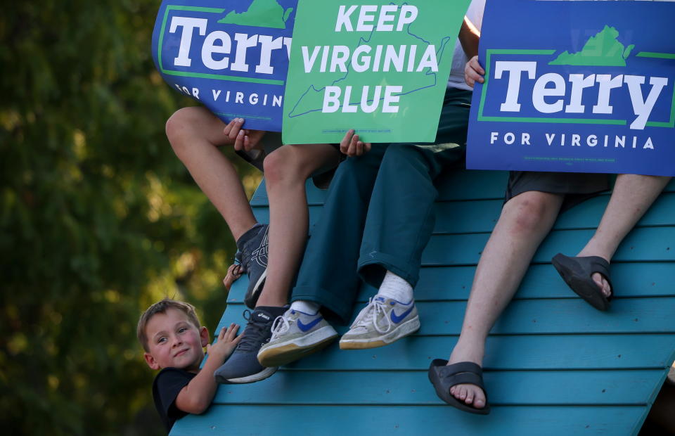 Supporters of candidate for Governor of Virginia Terry McAuliffe listen to speeches during a campaign event at Lubber Run Park in Arlington, Virginia, U.S., July 23, 2021. (Evelyn Hockstein/Reuters)