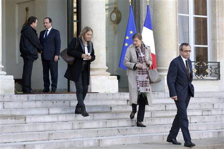 Yves Rocle (R), the head of the Africa news section of Radio France International (RFI), Cecile Megie (2ndR), Director of Radio France International, French CEO of France Media Monde Marie-Christine Saragosse (3rdR) leave the Elysee Palace following a meeting with French President Francois Hollande (2ndL) in Paris November 3, 2013. REUTERS/Gonzalo Fuentes