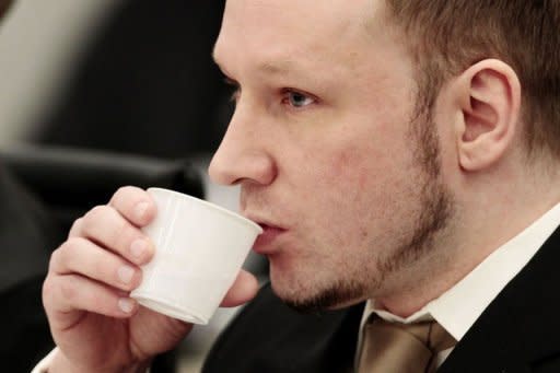 Rightwing extremist Anders Behring Breivik, who killed 77 people in twin attacks in Norway last year, takes a drink at the opening of his trial in Oslo district courtroom