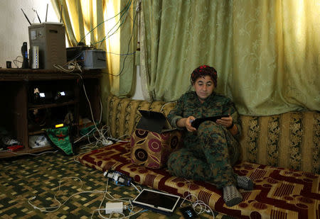 Nowruz Ahmed, General Commander of the Women's Protection Unit (YPJ) militia, the Kurdish People's protection unit (YPG)'s all-female brigade, sits inside an operation room in Raqqa, Syria August 26, 2017. Picture taken August 26, 2017. REUTERS/ Rodi Said