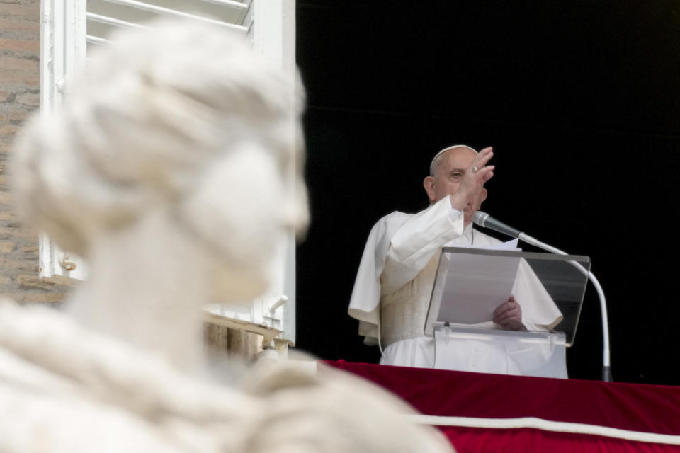 Pope Francis delivers his blessing as he recites the Angelus noon prayer from the window of his studio overlooking St.Peter's Square, at the Vatican, Sunday, May 30, 2021. (AP Photo/Andrew Medichini)