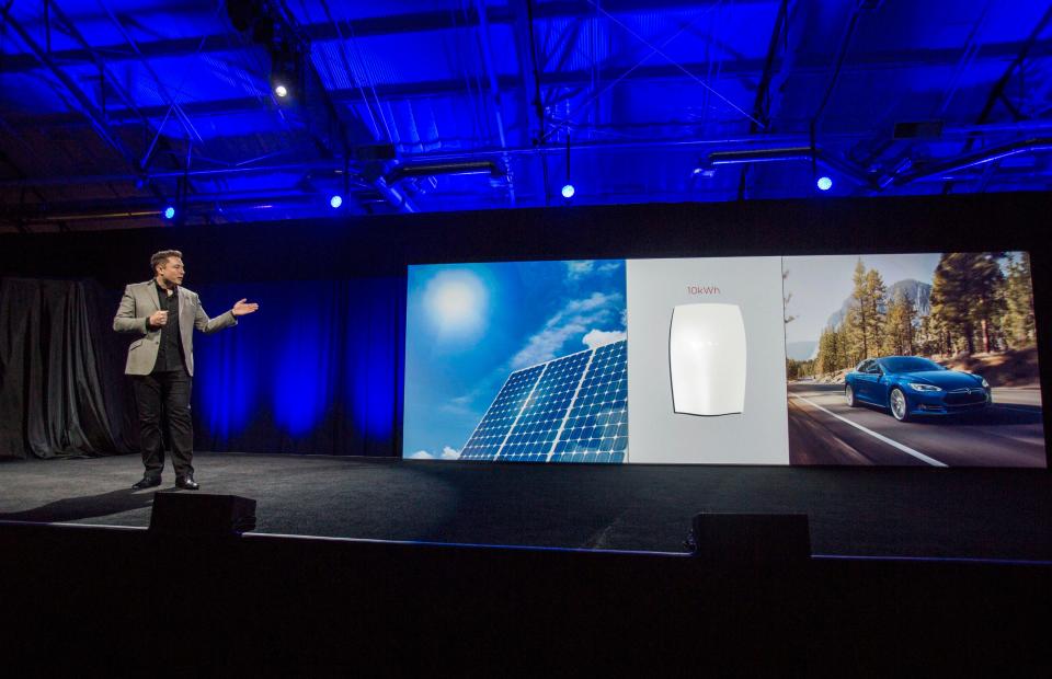 Elon Musk, CEO of Tesla Motors Inc., unveils the company's new product called "Powerwall" in Hawthorne, California, April 30, 2015. Musk is trying to steer his electric car company's battery technology into homes and businesses as part of an elaborate plan to reshape the power grid with millions of small power plants made of solar panels on roofs and batteries in garages.