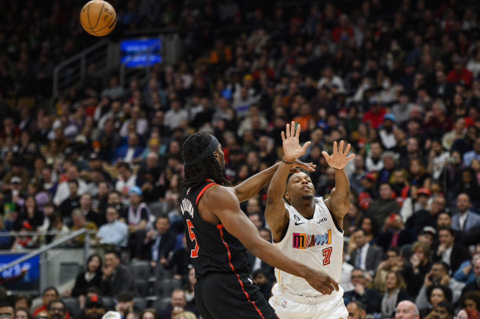 Miami Heat guard Kyle Lowry (7) is fouled by Toronto Raptors forward Precious Achiuwa (5) during the second half of an NBA basketball game Tuesday, March 28, 2023, in Toronto. (Christopher Katsarov/The Canadian Press via AP)