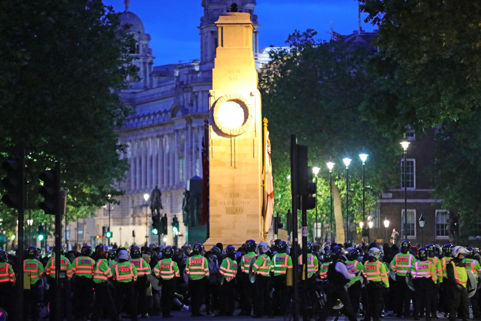 Police officers surround the cenotaph in Whitehall, London, during a Black Lives Matter protest rally. (PA)