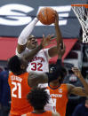 Ohio State forward E.J. Liddell, top, goes up to shoot against Illinois center Kofi Cockburn during the first half of an NCAA college basketball game in Columbus, Ohio, Saturday, March 6, 2021. (AP Photo/Paul Vernon)