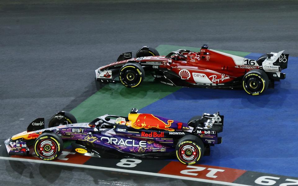 Max Verstappen of the Netherlands driving the (1) Oracle Red Bull Racing RB19 leads Charles Leclerc of Monaco driving the (16) Ferrari SF-23 at turn one during the F1 Grand Prix of Las Vegas at Las Vegas Strip Circuit on November 18, 2023 in Las Vegas, Nevada