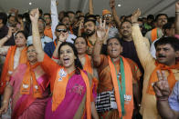 Supporters of India's ruling Bharatiya Janata Party celebrates early trends of party's victory in general elections at party's state head quarter in Gandhinagar, India, Thursday, May 23, 2019. (AP Photo/Ajit Solanki)