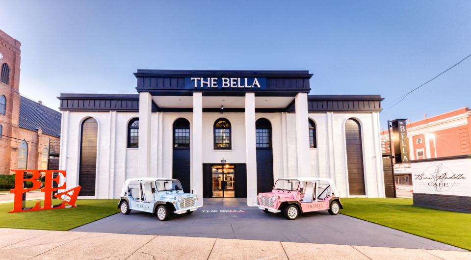 The new Bella Downtown Biloxi with rentable Mokes out front.