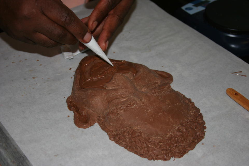 A dessert chef makes a chocolate sculpture of Barack Obama's face outside the media filing center for the Democratic National Convention on Thursday Sept. 6, 2012. (Torrey AndersonSchoepe/Yahoo! News)