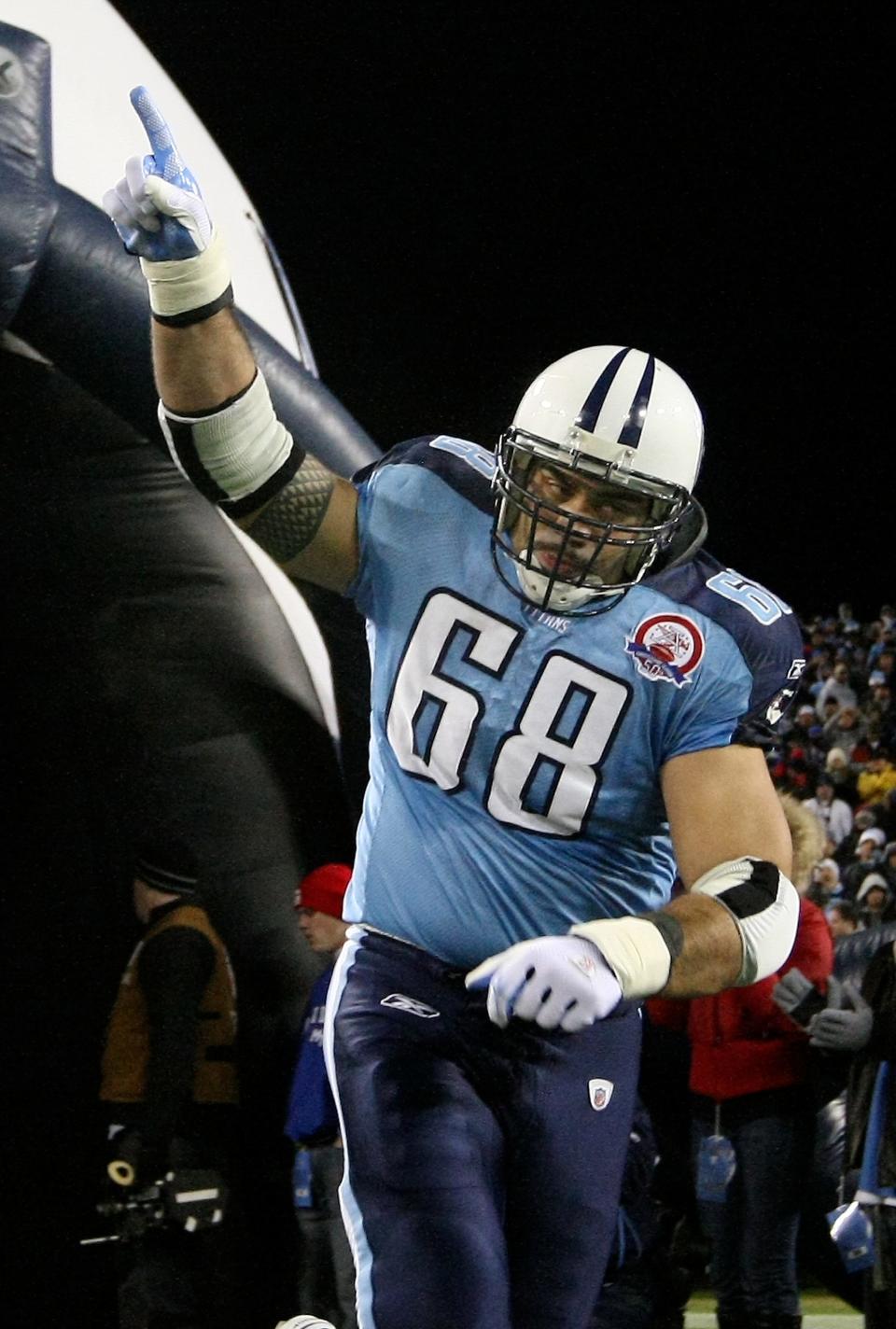 Tennessee Titans center Kevin Mawae (68) points to the sky as he comes out of the tunnel during introduction before the start their game against the San Diego Chargers at LP Field.December 25, 2009.