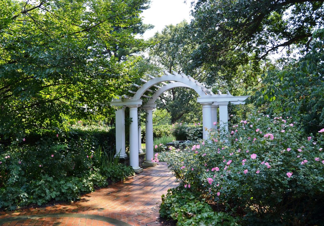An arch and flowers at the Friends of the Frelinghuysen Arboretum.
