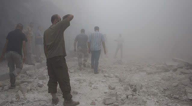 A man looks at the rubble following an airstrike in Aleppo. Photo: Getty Images