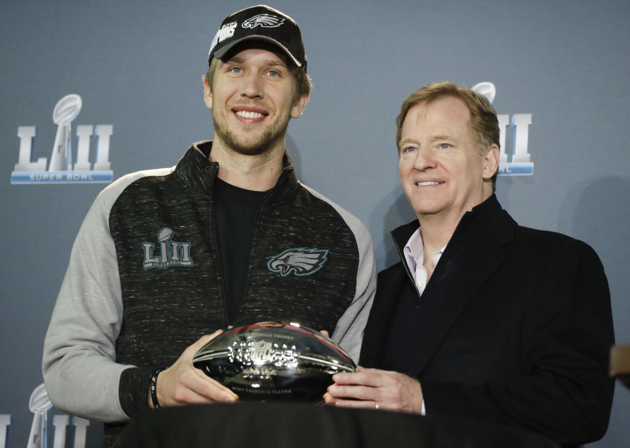 NFL commissioner Roger Goodell and Eagles quarterback Nick Foles poses with the QB's MVP trophy on Monday. (AP) 