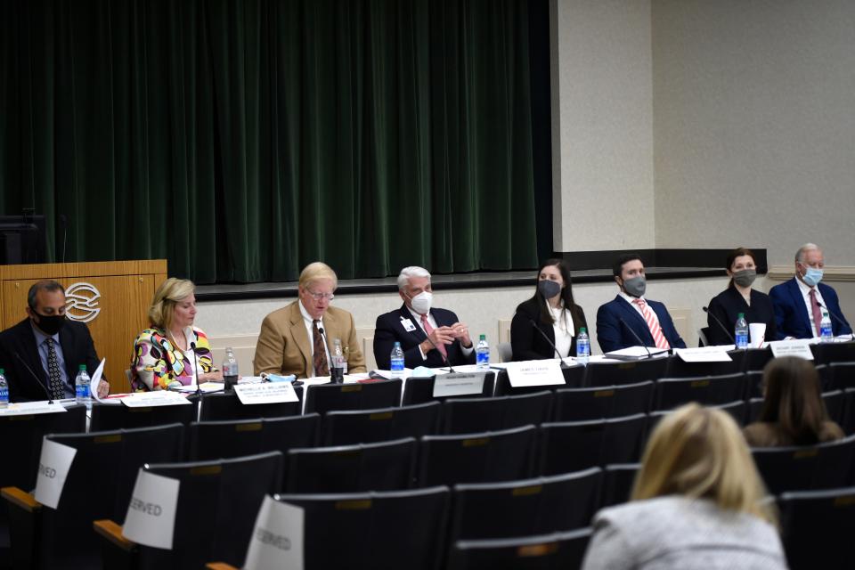 FILE - Panelists for the public hearing for the proposed merger of University Hospital and Piedmont Healthcare at University Hospital on Tuesday, Dec. 14, 2021.