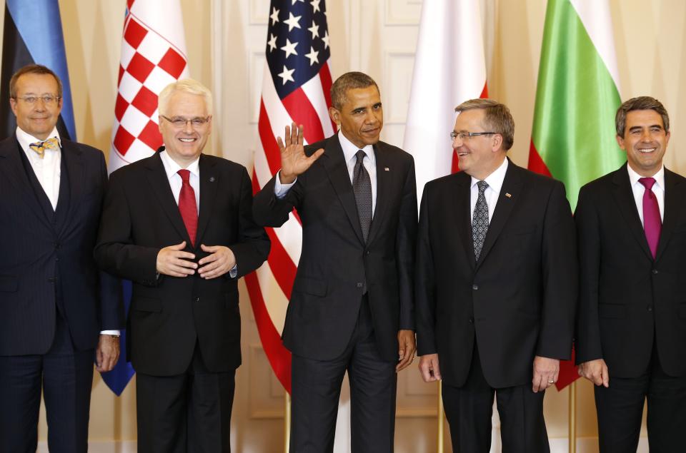 U.S. President Barack Obama takes part in a group photo following a meeting with Central and Eastern European Leaders at the Presidential Palace in Warsaw June 3, 2014. Obama promised on Tuesday to beef up military support for eastern European members of the NATO alliance who fear they could be next in the firing line after the Kremlin's intervention in Ukraine. From (L-R): Estonia's President Toomas Hendrik Ilves, Croatia's President Ivo Josipovic, U.S. President Barack Obama, Poland's President Bronislaw Komorowski and Bulgaria's President Rosen Plevneliev. REUTERS/Kevin Lamarque (POLAND - Tags: POLITICS)