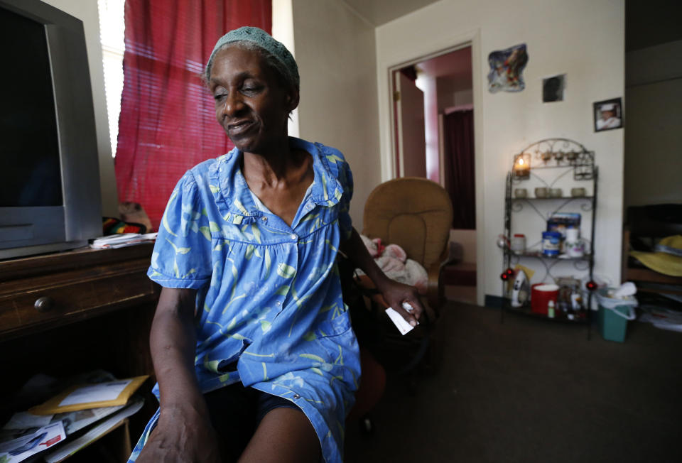 Janet Arnett sits in her apartment in Epiphany House, a low-income senior home in Baltimore, Tuesday, July 3, 2012, as she awaits return of electricity for the first time since last weekend's severe storms. Utility crews struggled Tuesday to restore power to more than 1 million people in the eastern U.S. as frustration grew four days after storms that have led to 24 deaths so far. Officials worried the toll could rise because of stifling conditions and generator fumes. (AP Photo/Patrick Semansky)