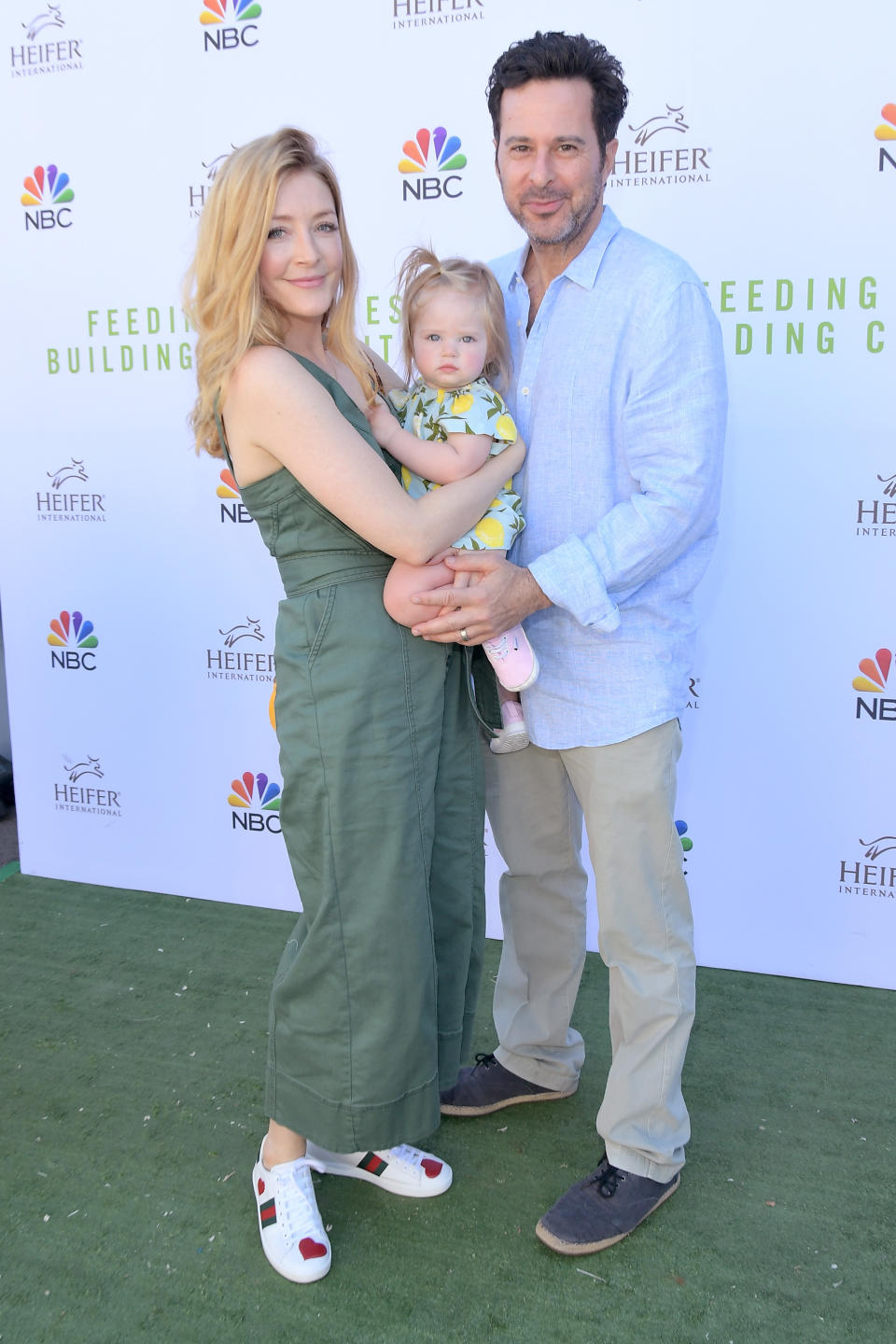 they're dressed casually with their baby at an NBC event