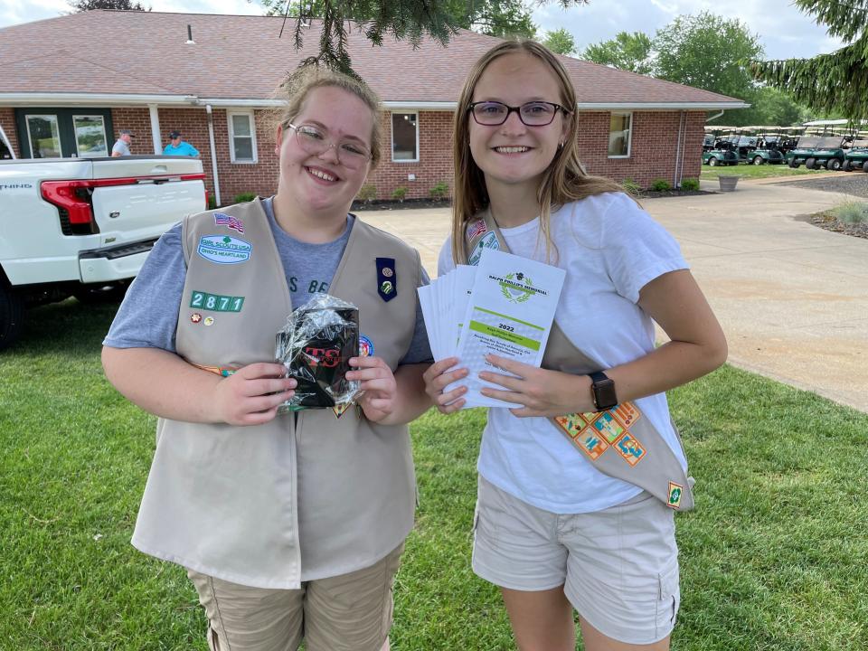 Each year members of the Girl Scouts and Boy 
Scouts volunteer at the Ralph Phillips Memorial Golf Tournament, handing out goody bags 
and assisting with door prizes at the dinner.