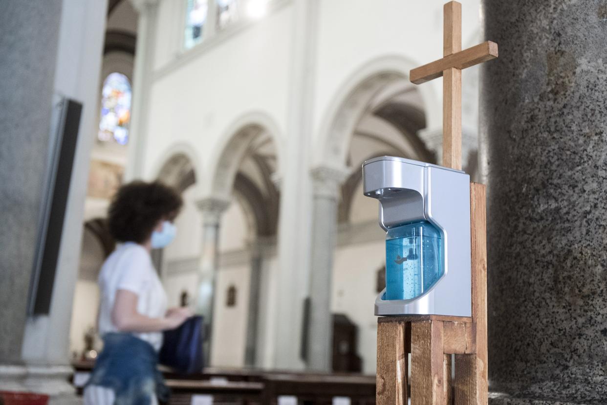 A disinfectant dispenser is placed at the Ognissanti church in Rome, Italy on Monday, May 18, 2020, as Italy is slowly lifting sanitary restrictions after a two-month coronavirus lockdown. Today is the first day the presence of faithful is allowed during public masses since Italy's lockdown due to the COVID-19 pandemic.