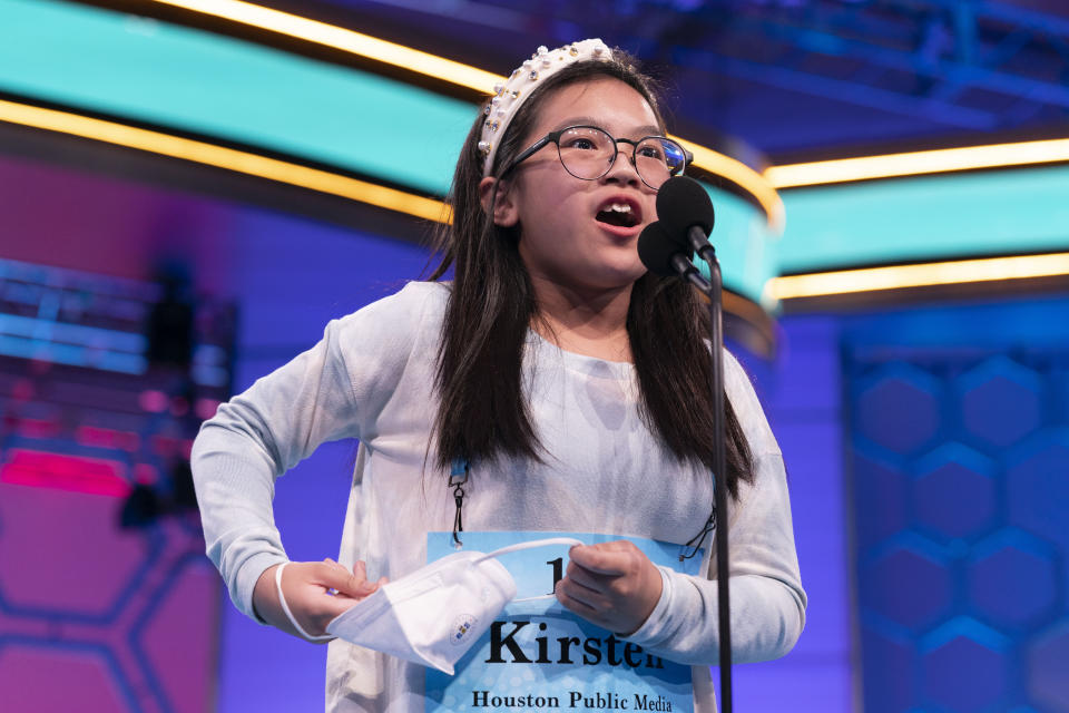 Kirsten Tiffany Santos, 11, from Richmond, Texas, reacts after spelling her word correctly during the Scripps National Spelling Bee, Wednesday, June 1, 2022, in Oxon Hill, Md. (AP Photo/Andrew Harnik)