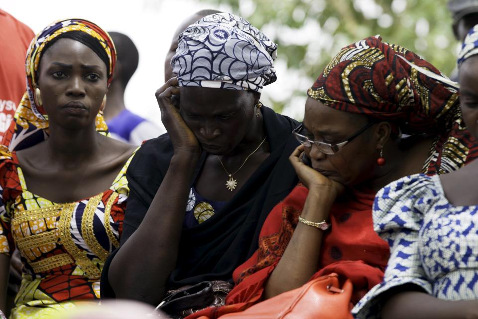 Women reflect as they mark the one-year anniversary of the mass kidnapping of more than 200 schoolgirls from a secondary school in Chibok by Boko Haram militants, in Abuja April 14, 2015. Nigeria's President-elect Muhammadu Buhari vowed on Tuesday to make every effort to free the schoolgirls abducted by Boko Haram militants a year ago but admitted it was not clear whether they would ever be found. A march is expected to be held in Abuja on Tuesday to mark the anniversary. (REUTERS/Afolabi Sotunde)