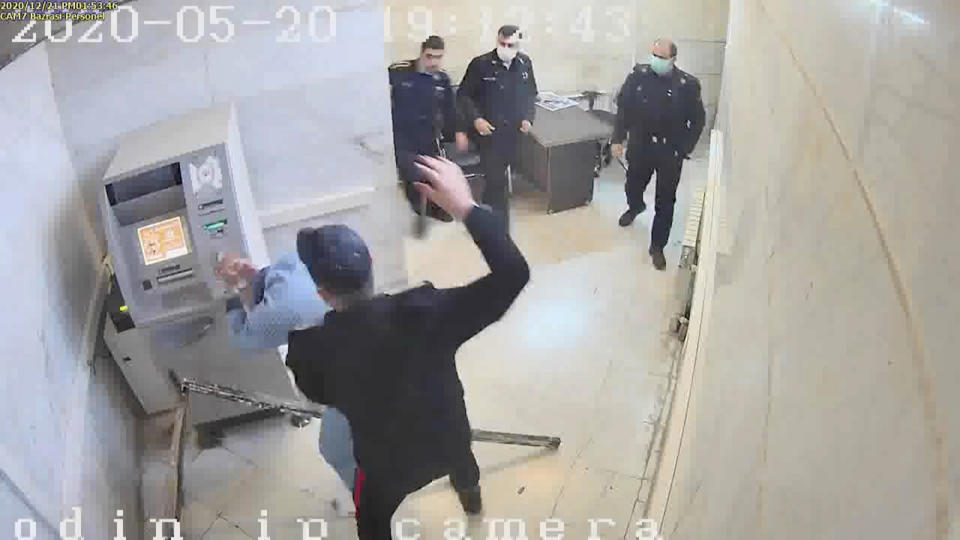 In this undated frame grab taken from video shared with The Associated Press by a self-identified hacker group called "The Justice of Ali," a guard beats a prisoner, at Evin prison in Tehran, Iran. The alleged hackers said the release of the footage was an effort to show the grim conditions at the prison, known for holding political prisoners and those with ties abroad who are often used as bargaining chips in negotiations with the West. (The Justice of Ali via AP)