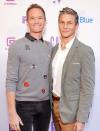 <p>Neil Patrick Harris and David Burtka coordinate in shades of gray on Sept. 20 at The Public Theater's 2021 annual gala at the Delacorte Theater in New York City's Central Park.</p>