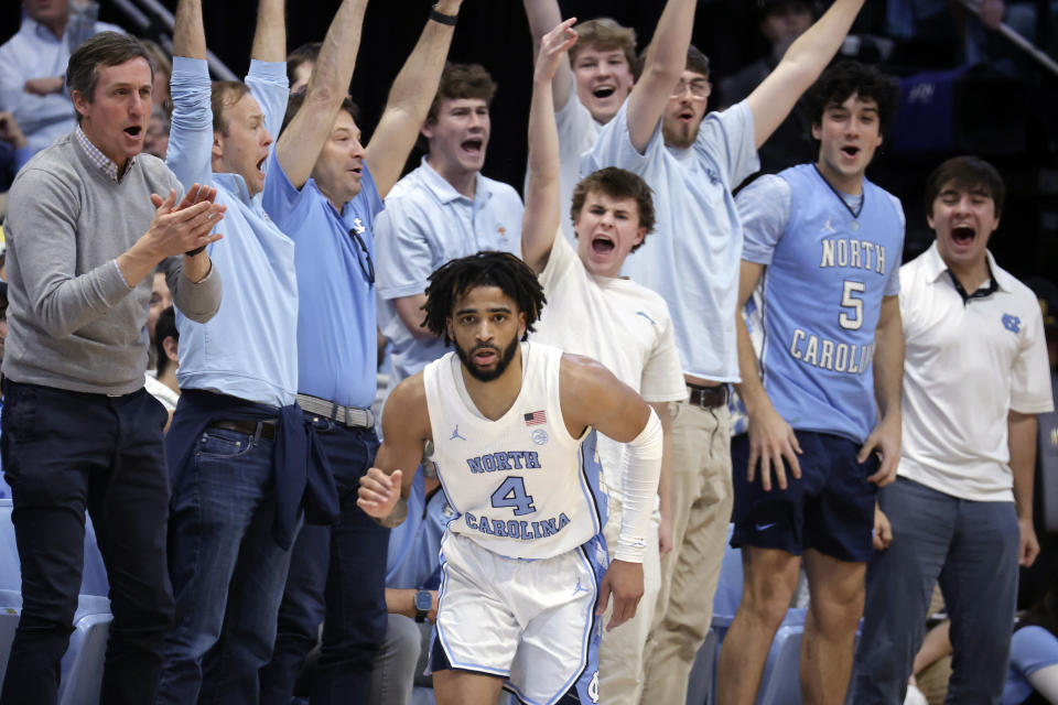 Fans cheer after North Carolina guard RJ Davis (4) scored during the second half of an NCAA college basketball game against Miami, Monday, Feb. 26, 2024, in Chapel Hill, N.C. (AP Photo/Chris Seward)
