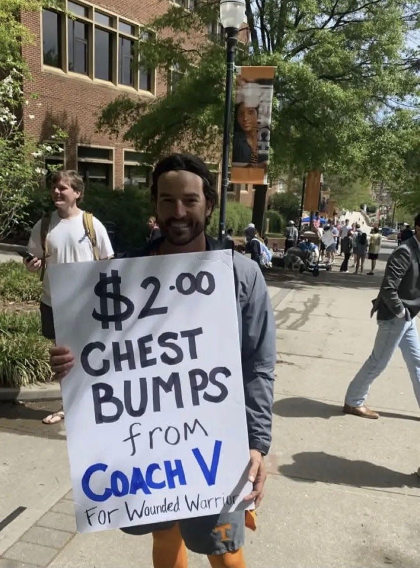 Tennessee baseball coach Tony Vitello gave chest bumps for charity Wednesday in the wake of his chest bump-related suspension.