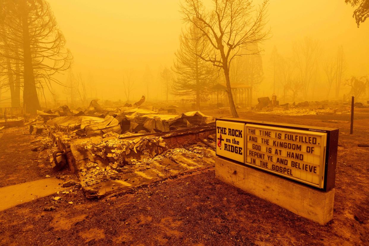 A burned church rests in heavy smoke during the Dixie fire in Greenville, Calif. on Aug. 6, 2021.