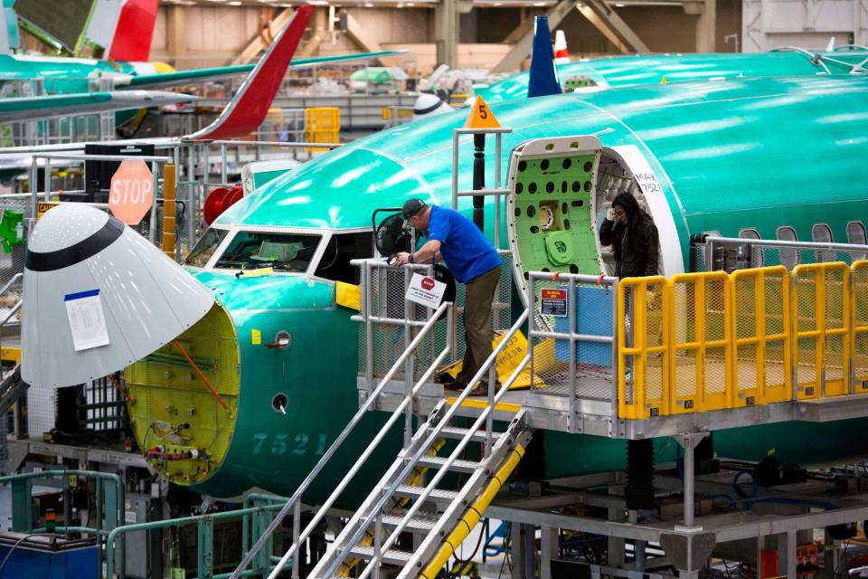 Employees work on Boeing 737 MAX airplanes at the Boeing Renton Factory in Renton, Washington: AFP/Getty Images