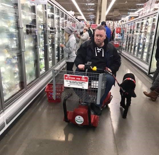 Marty Lukaszewski, a South Bend native now living in New Hope, Minn., relies on his service dog Laverne daily to deal with Parkinson's disease.