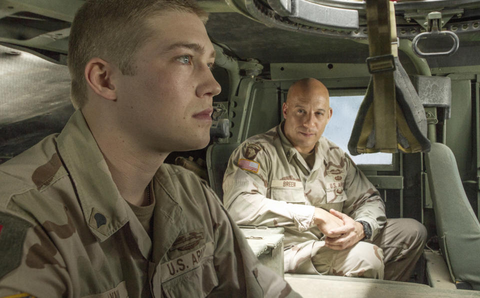 Billy Lynn ( Joe Alwyn) talks to Shroom (Vin Diesel) in TriStar Pictures' BILLY LYNN'S LONG HALFTIME WALK.