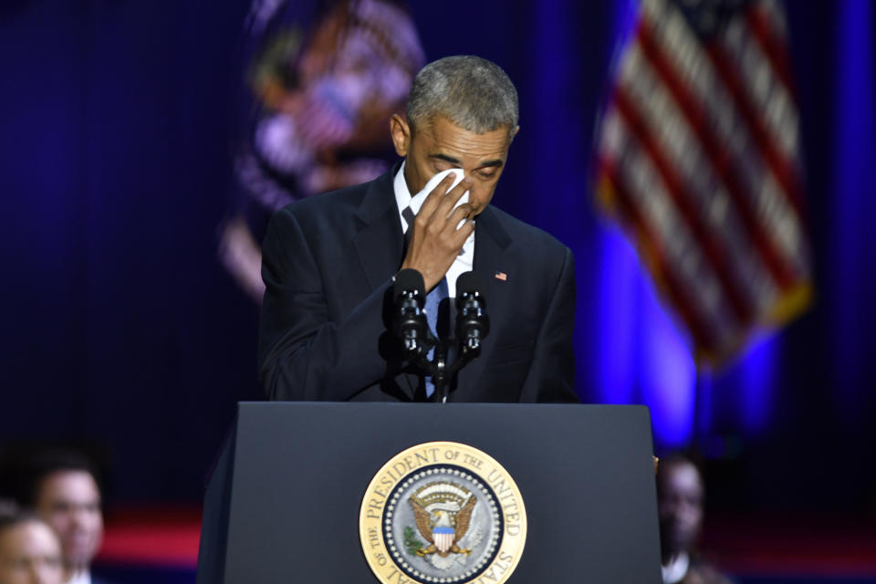 Obama wipes his tears while speaking about his wife, Michelle.