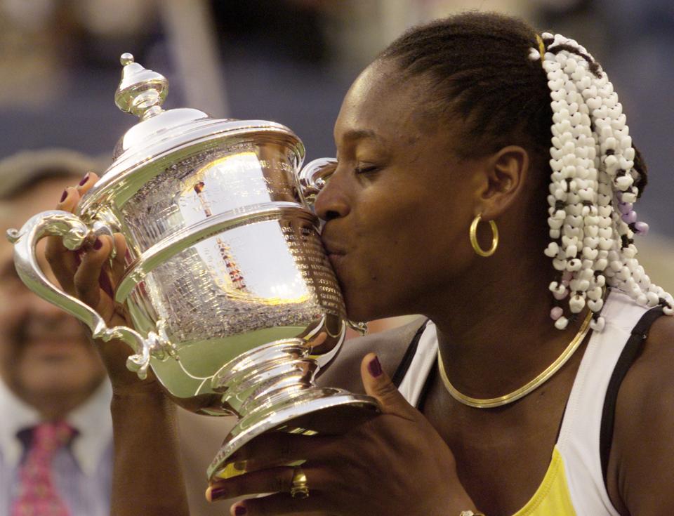 Serena Williams kisses the US Open trophy upon winning the first Grand Slam title of her career in 1999.