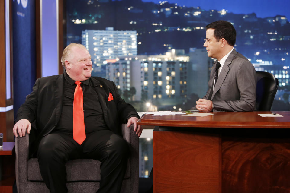 FILE - This March 3, 2014 file image released by ABC shows Toronto Mayor Rob Ford, left, with host Jimmy Kimmel on the late night talk show "Jimmy Kimmel Live," in Los Angeles. Ford is claiming he wouldn't know Kevin Spacey "if I ran over him," a week after the House of Cards star poked fun at the mayor when both appeared on "Jimmy Kimmel Live." (AP Photo/ABC, Randy Holmes, File)