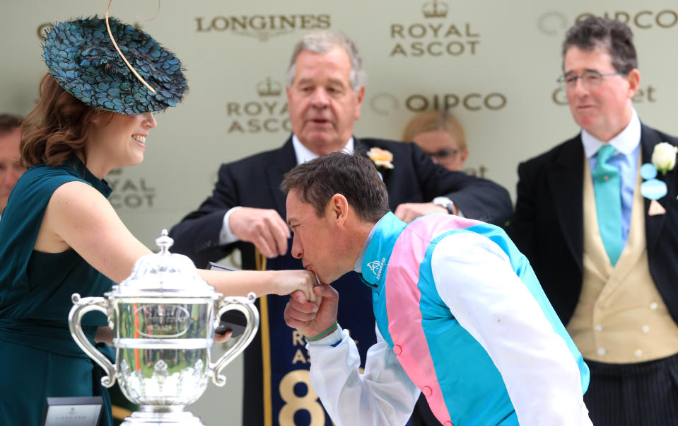 Jockey Frankie Dettori kisses Princess Eugenie after winning the Hampton Court Stakes.<em> [Photo: PA]</em>