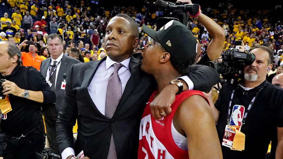 Ujiri, left, and Lowry share an embrace on the court. (Mandatory Credit: Kyle Terada-USA TODAY Sports)