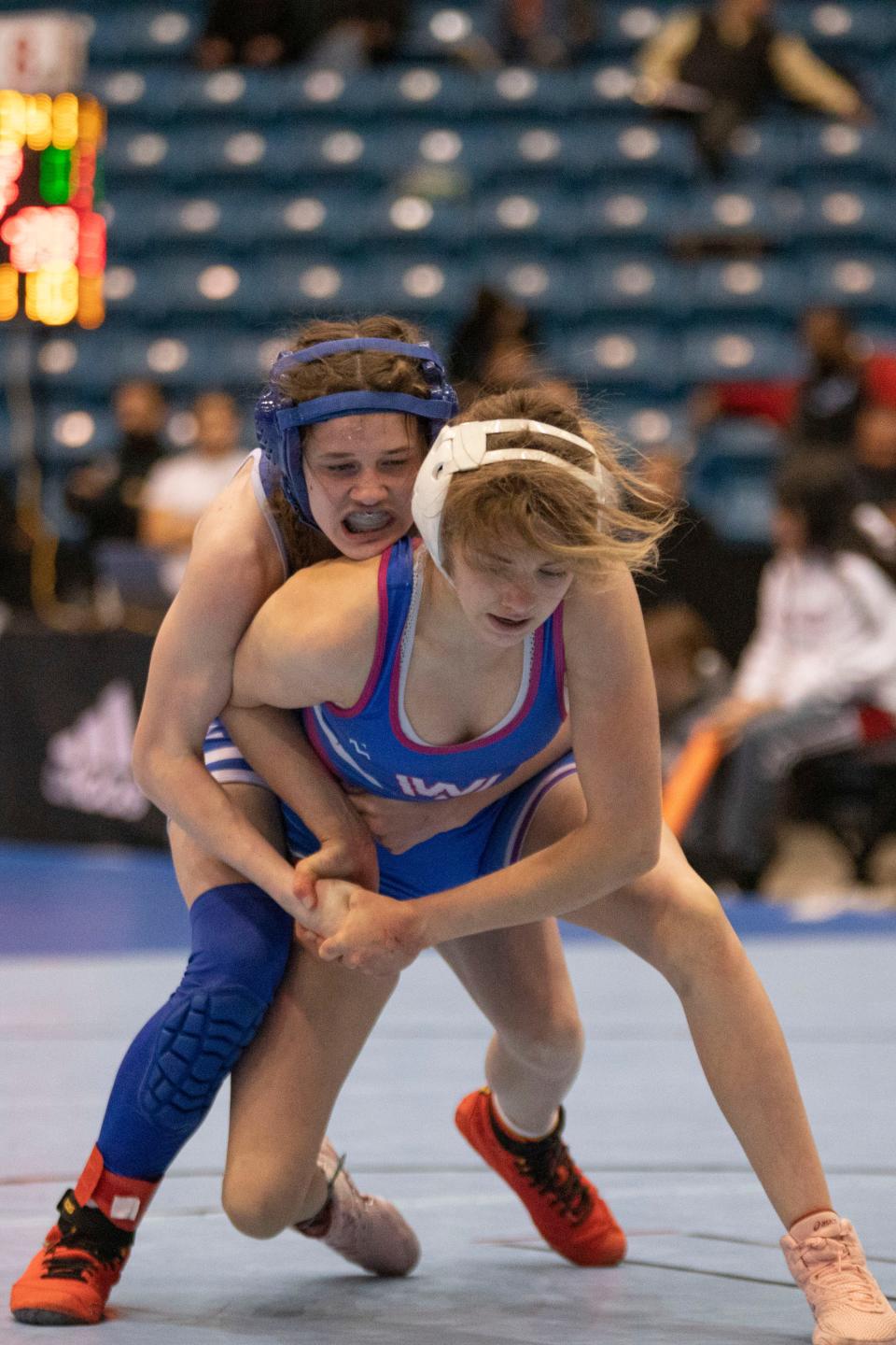 Washburn Rural's Kristen Rezac wrestles against Kapaun Mt. Carmel's Taylor Barringer during 6-5A State Wrestling. Rezac earned 1st team All-City honors.