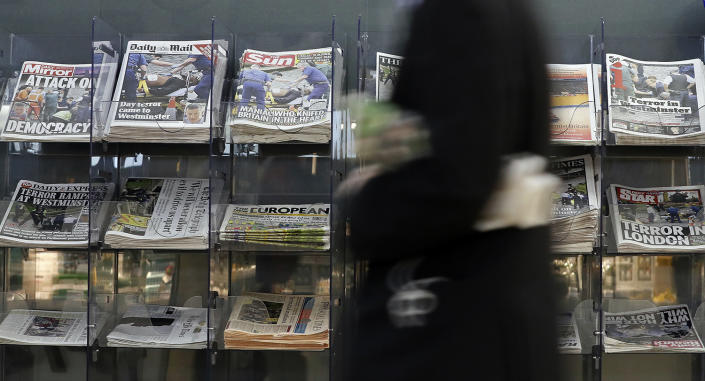 <p>A man passes a newspaper stand showing coverage of Wednesday’s attack in London, Thursday March 23, 2017. (Kirsty Wigglesworth/AP) </p>