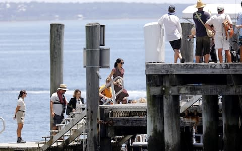 The Duchess of Sussex arrives at Kingfisher jetty by boat - Credit: Catherine Lyn Finch /Getty