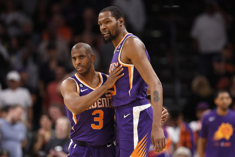 PHOENIX, ARIZONA - MARCH 29: Chris Paul #3 and Kevin Durant #35 of the Phoenix Suns celebrate after defeating the Minnesota Timberwolves in NBA game at Footprint Center on March 29, 2023 in Phoenix, Arizona. The Suns defeated the Timberwolves 107-100.  NOTE TO USER: User expressly acknowledges and agrees that, by downloading and or using this photograph, User is consenting to the terms and conditions of the Getty Images License Agreement.  (Photo by Christian Petersen/Getty Images)