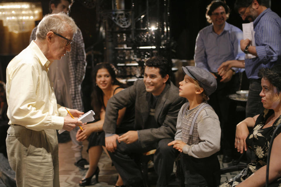 This Aug. 21, 2008 photo released by the LA Opera shows director Woody Allen, left, speaking with a young cast member as Albanian tenor Saimir Pirgu, center, looks on during a rehearsal of "Gianni Schicchi" in Los Angeles. At 31, Pirgu is an even hotter hire in the music business, having worked closely with two of The Three Tenors who were stadium megastars _ Placido Domingo and the late Luciano Pavarotti. He's appearing with the San Francisco Opera in Bellini's “I Capuleti e i Montecchi,” a reworking of the Romeo and Juliet story that runs through Oct. 19. (AP Photo LA Opera, Robert Millard)