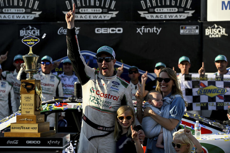 Driver Brad Keselowski, front left, celebrates alongside his family in Victory Lane after winning a NASCAR Cup Series auto race at Darlington Raceway, Sunday, May 12, 2024, in Darlington, S.C. (AP Photo/Matt Kelley)